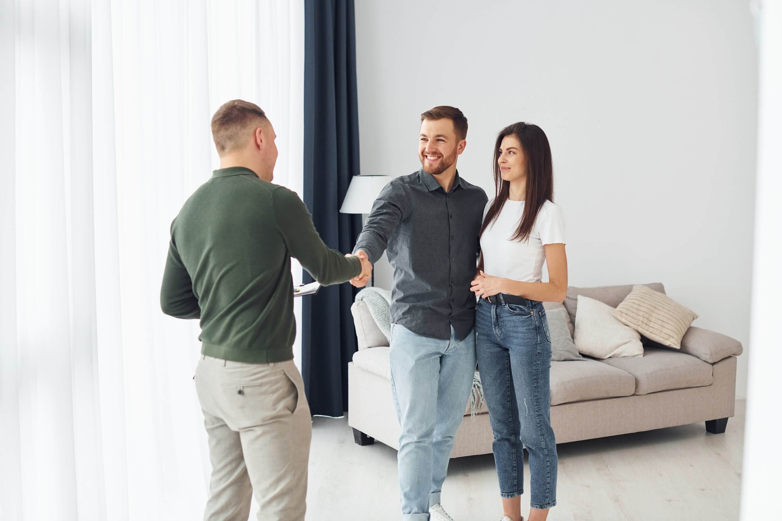 Salesman Helps Young Couple in choosing an Apartment